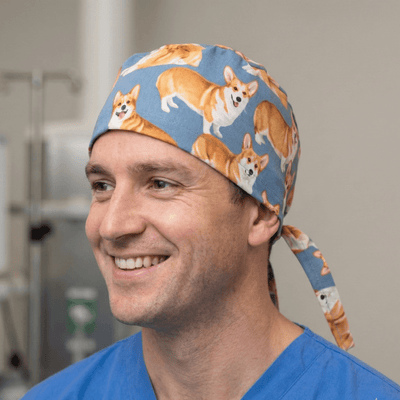 Royal Corgi Dogs scrub cap shown on model