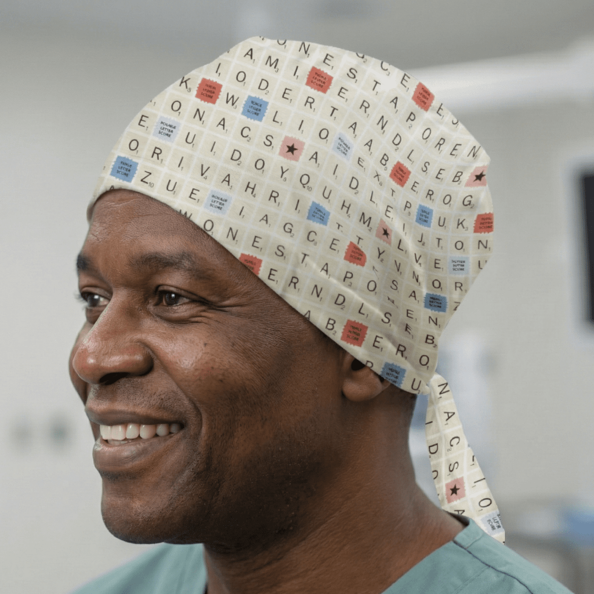 Woman wearing scrub cap with Scrabble board game print