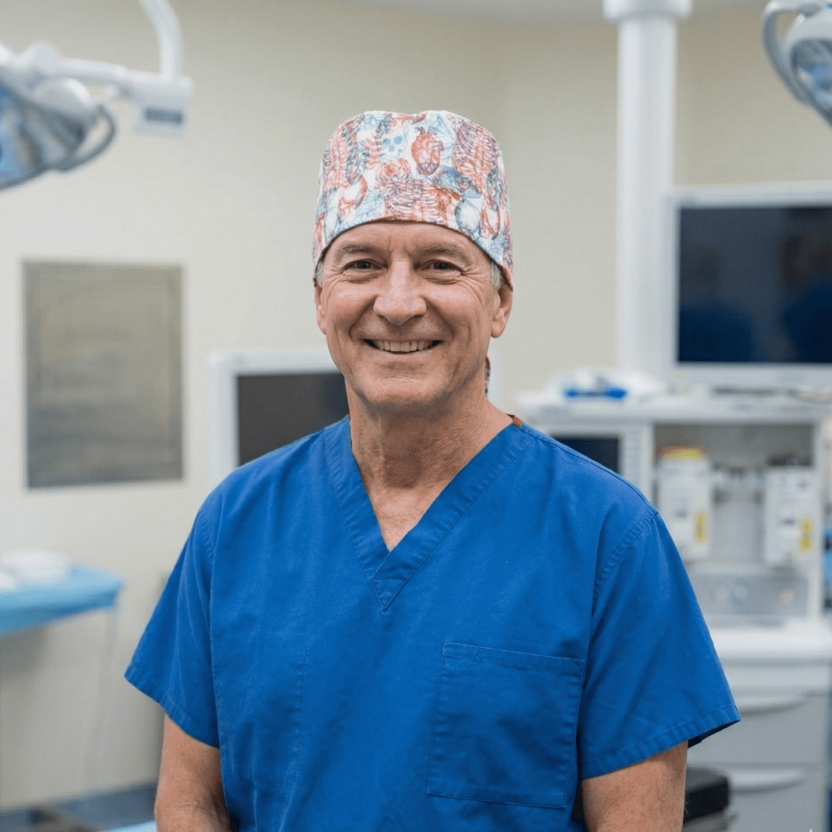 Medical professional wearing white Skeleton 3D Vision scrub cap with anatomical pattern in operating room