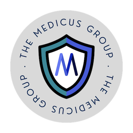 A circular logo with a gray background displaying a shield in blue and teal with the letter M in the center. Surrounding the shield, the text reads The Medicus Group in a circular layout.