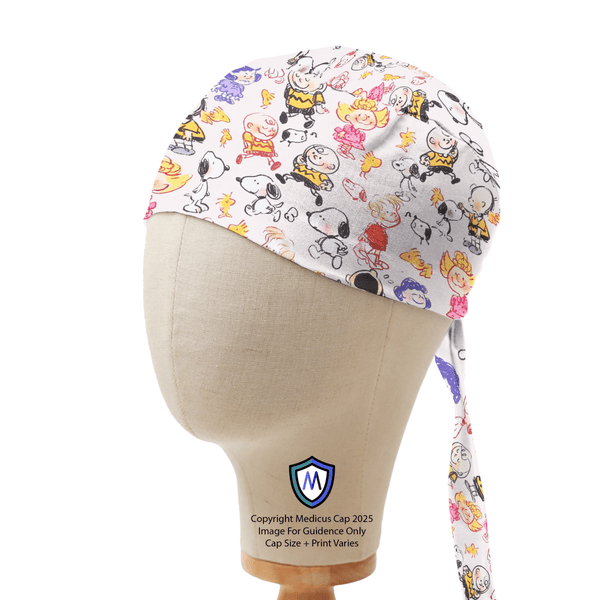 Captain style scrub cap with Snoopy and Charlie Brown scribble-style cartoon print on white background, displayed on mannequin side view.