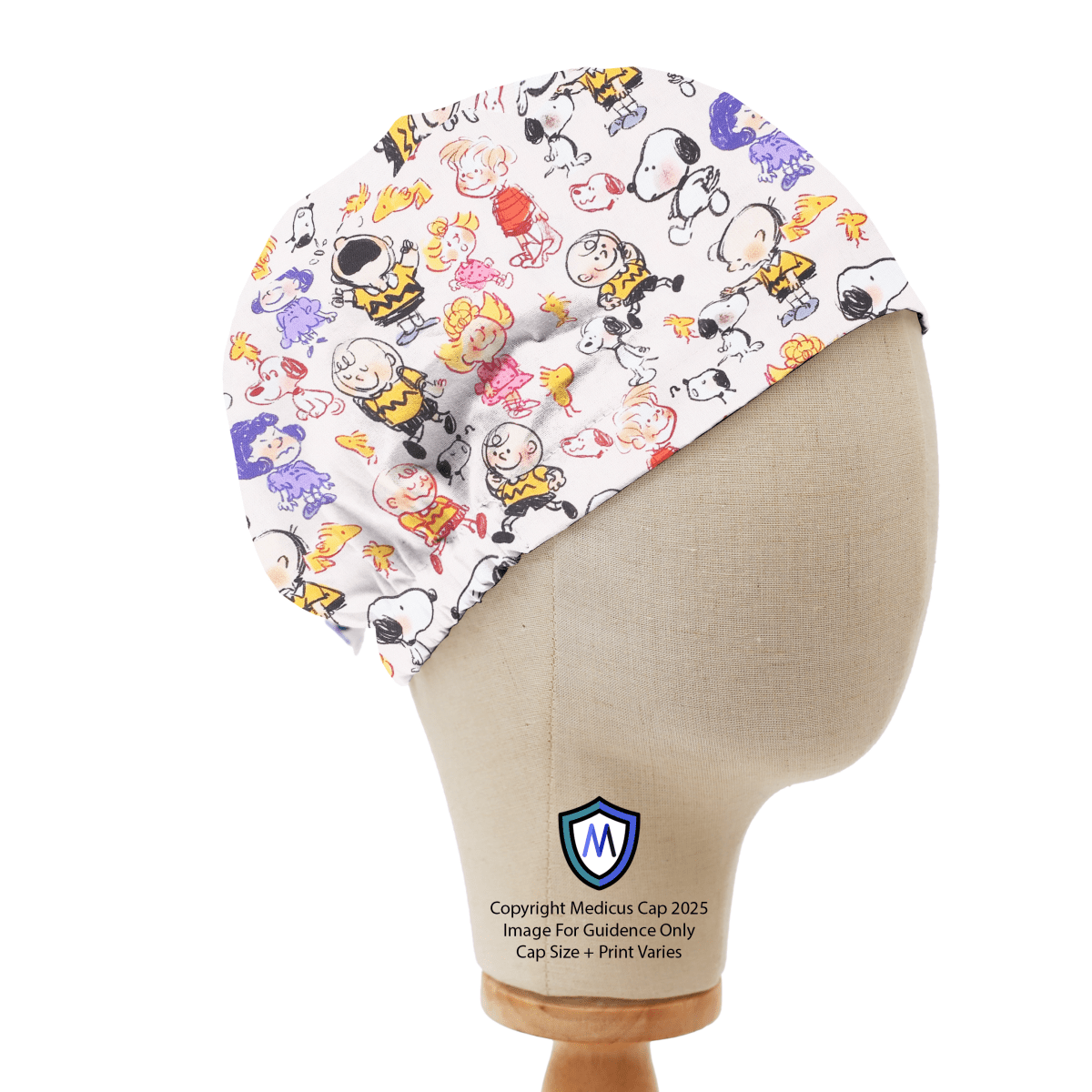 Elastic-backed scrub cap with Snoopy and Charlie Brown scribble-style cartoon print on white background, shown on a mannequin side view.