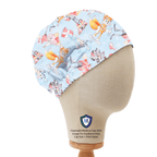 Side view of Sonic + Friends cartoon style scrub cap with colorful characters on light blue fabric