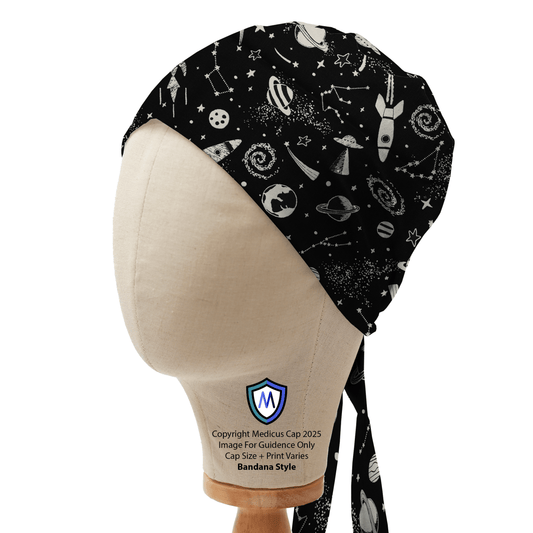 Bandana-style scrub cap with glow-in-the-dark rockets and space print by Medicus Caps, displayed on a mannequin.