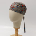 Side view of grey scrub cap with cute kawaii Spiderman characters pattern on mannequin head