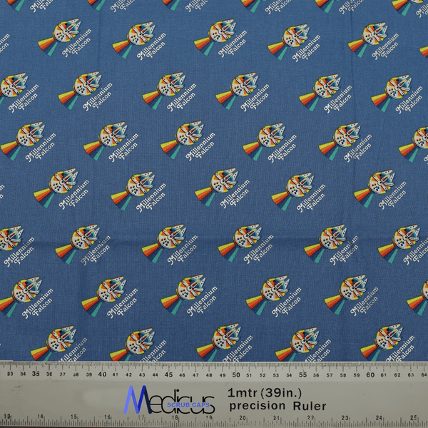 Close-up of Star Wars Pride Millennium Falcon fabric with ruler for scale, used in Medicus Scrub Caps mini scrub caps.