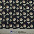 Close-up of Baby Yoda kawaii fabric pattern with a ruler for scale, used in Medicus Scrub Caps' "Star Wars Baby Yoda Kawaii" scrub cap.