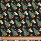 Close-up view of Star Wars Christmas scrub cap fabric showing Yoda, Christmas trees and holiday elements pattern