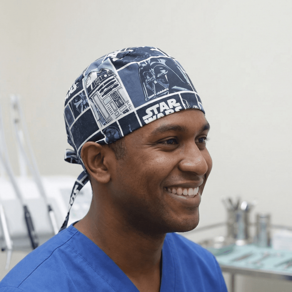Navy blue Star Wars themed scrub cap with comic strip pattern and tie-back design