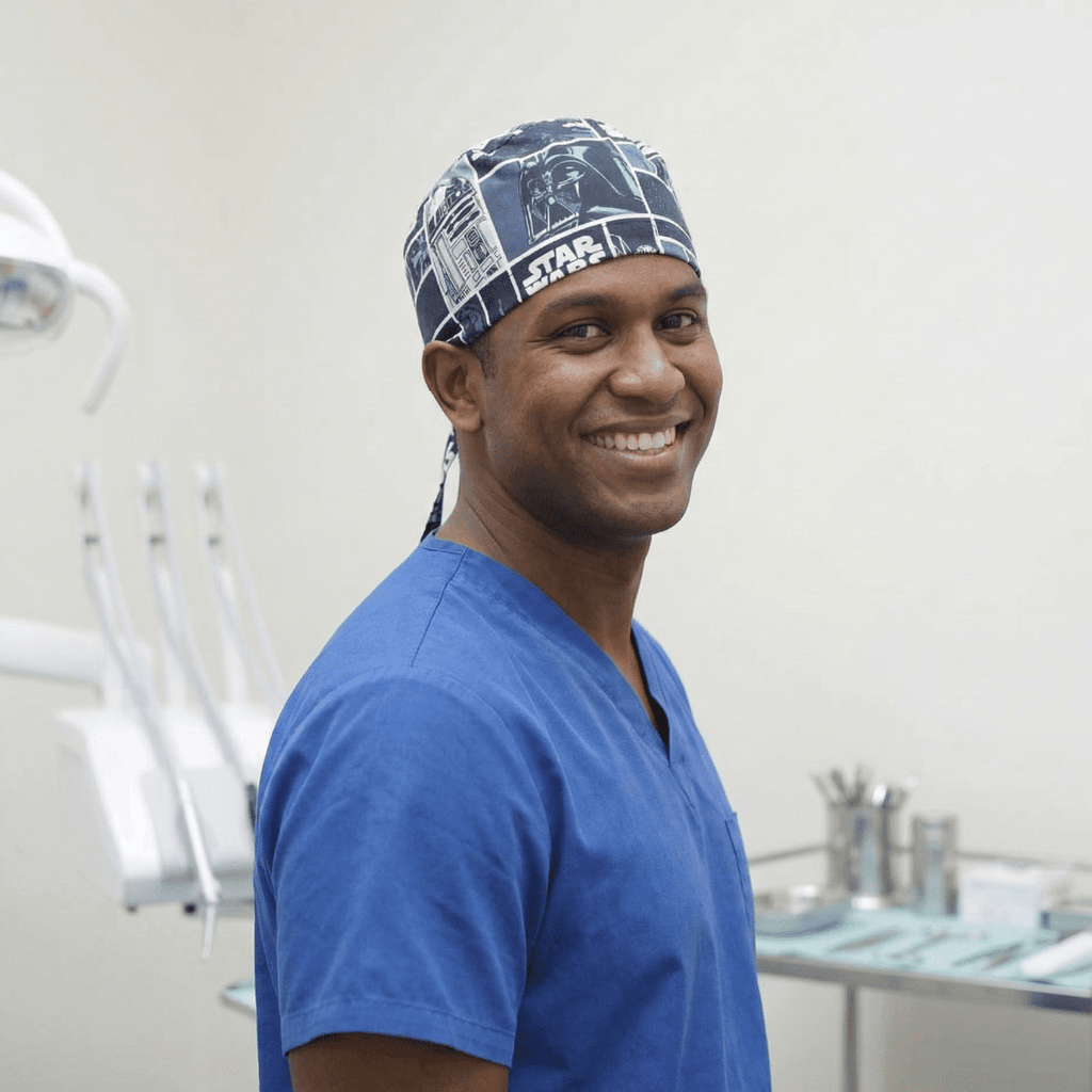 Healthcare professional wearing Star Wars blue patterned scrub cap, side profile view showing comfortable fit