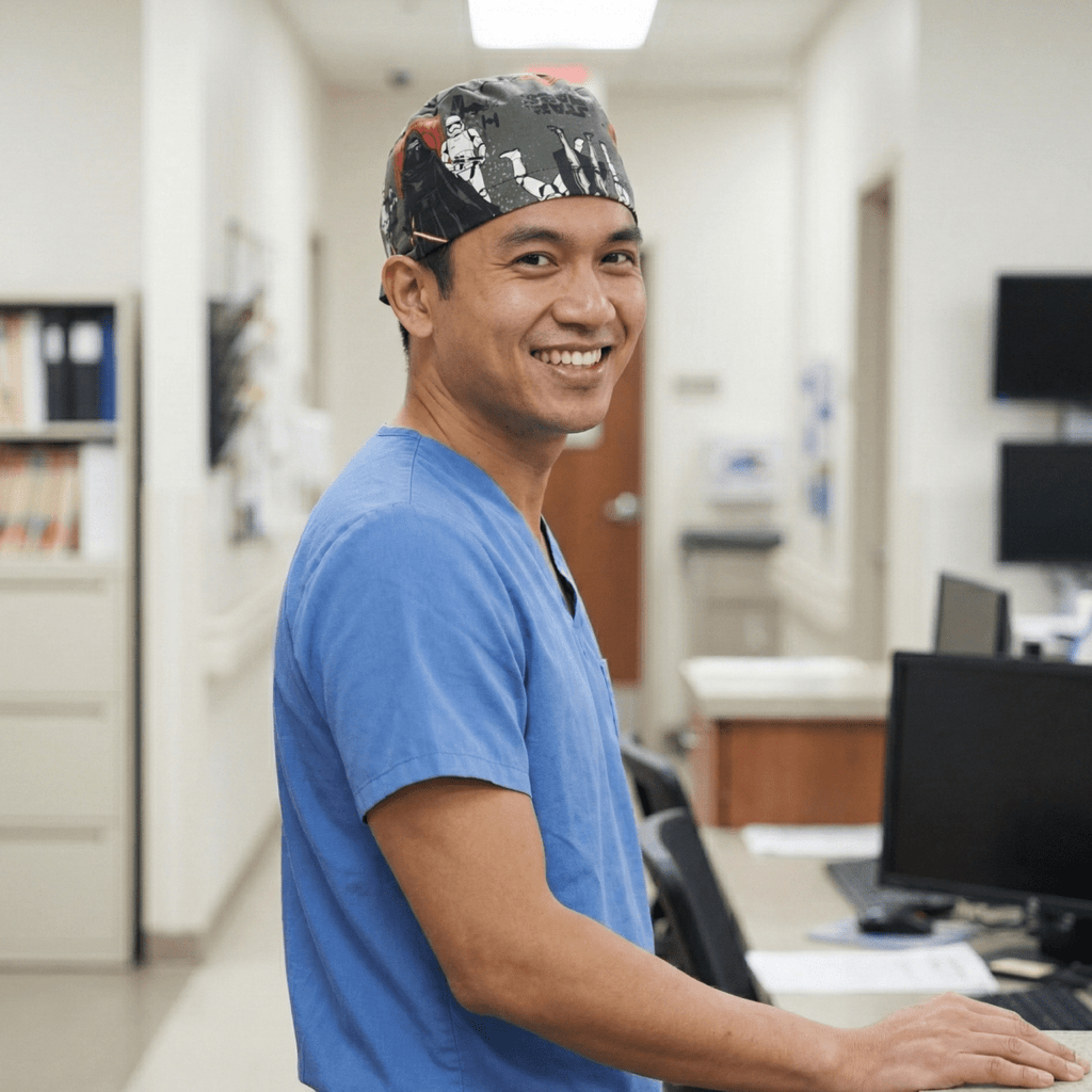 Healthcare worker wearing Star Wars Last Jedi scrub cap with dark patterned design, side profile view