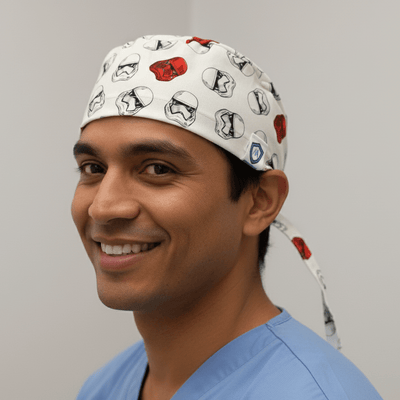 White Star Wars Stormtrooper helmet pattern scrub cap with red accents and tie-back