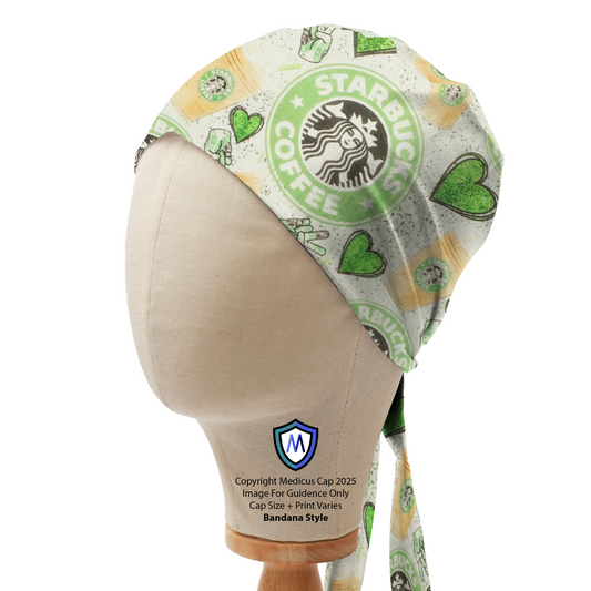 A mannequin head displays a Medicus Scrub Caps Starbucks Love Green Hearts Scrub Cap with coffee-themed designs, including Starbucks logos, green hearts, and coffee cups.