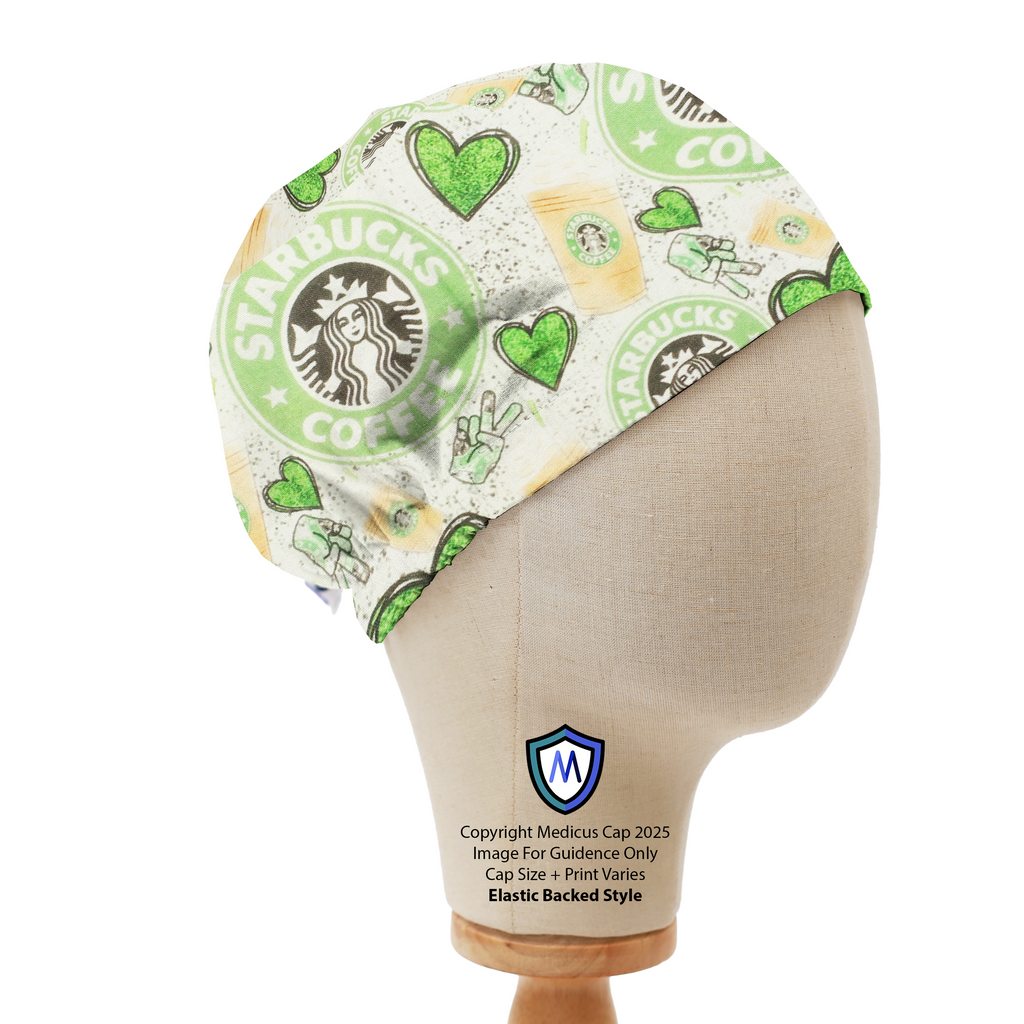 A mannequin head displays the Medicus Scrub Caps Starbucks Love Green Hearts Scrub Cap, featuring Starbucks logos, green hearts, and peace signs on a white background.