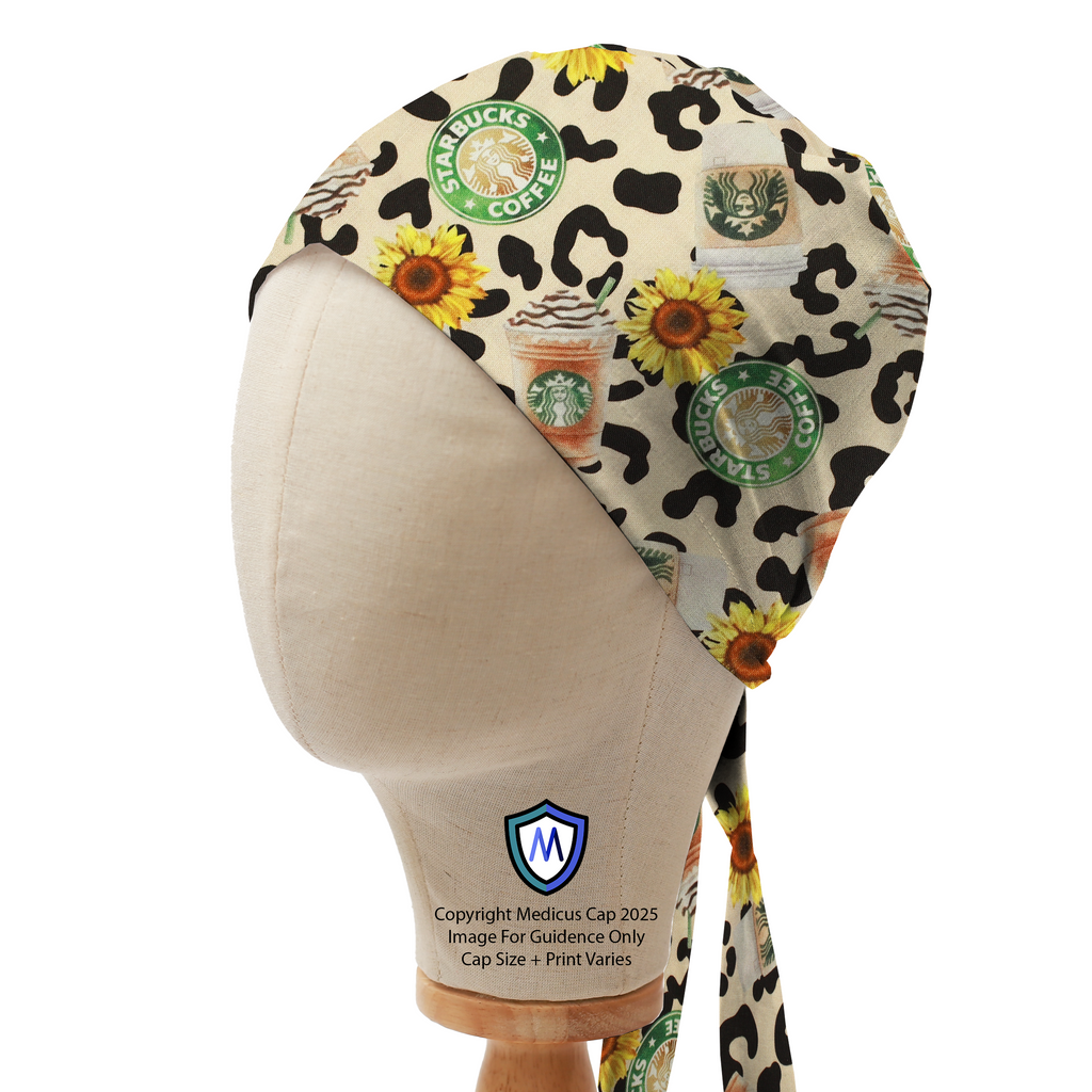 Mannequin head wearing a Medicus Scrub Cap with Starbucks logos, pumpkin spice lattes, sunflowers, and leopard print in a bandana style.
