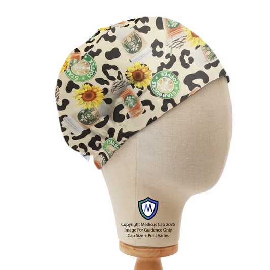 Mannequin head wearing a Medicus Scrub Cap with Starbucks logos, pumpkin spice lattes, sunflowers, and leopard print. Elastic-backed for a secure fit.