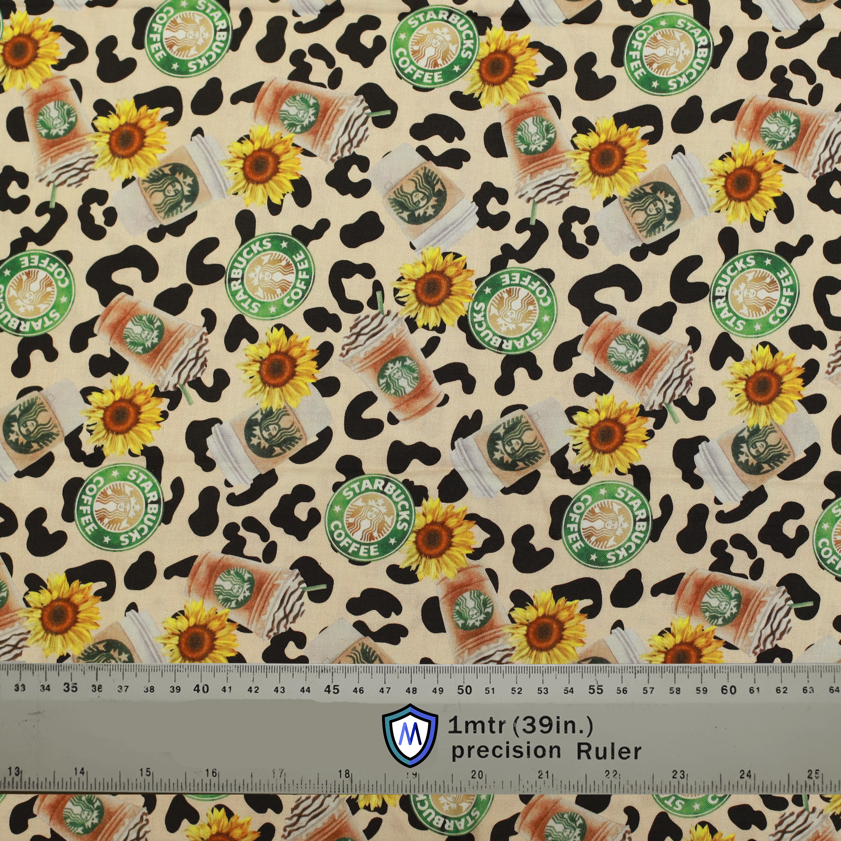 Fabric for Medicus Scrub Cap featuring Starbucks logos, pumpkin spice lattes, sunflowers, and leopard print. 1-meter ruler included for scale.