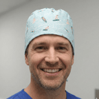 Light blue surfer pattern scrub cap with orange and white surfboard designs