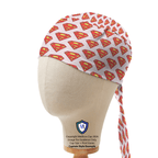 Side view of Superman logo patterned scrub cap showing red and yellow emblems on white fabric with tie detail