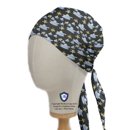 Anaesthetist Sweet Dreams Made Of These Scrub Cap from Medicus Scrub Caps, featuring a dreamy design with clouds, stars, and text on a dark background.