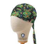Side view of TMNT scrub cap showing green turtle characters and pizza slice pattern with tie detail