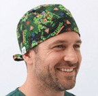 TMNT Teenage Mutant Ninja Turtles pizza pattern scrub cap with colourful cartoon characters on dark green background