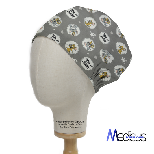 Tom And Jerry Circles Grey Scrub Cap from Medicus Scrub Caps, featuring a fun cartoon pattern on a grey background. Comfortable and stylish for medical professionals.