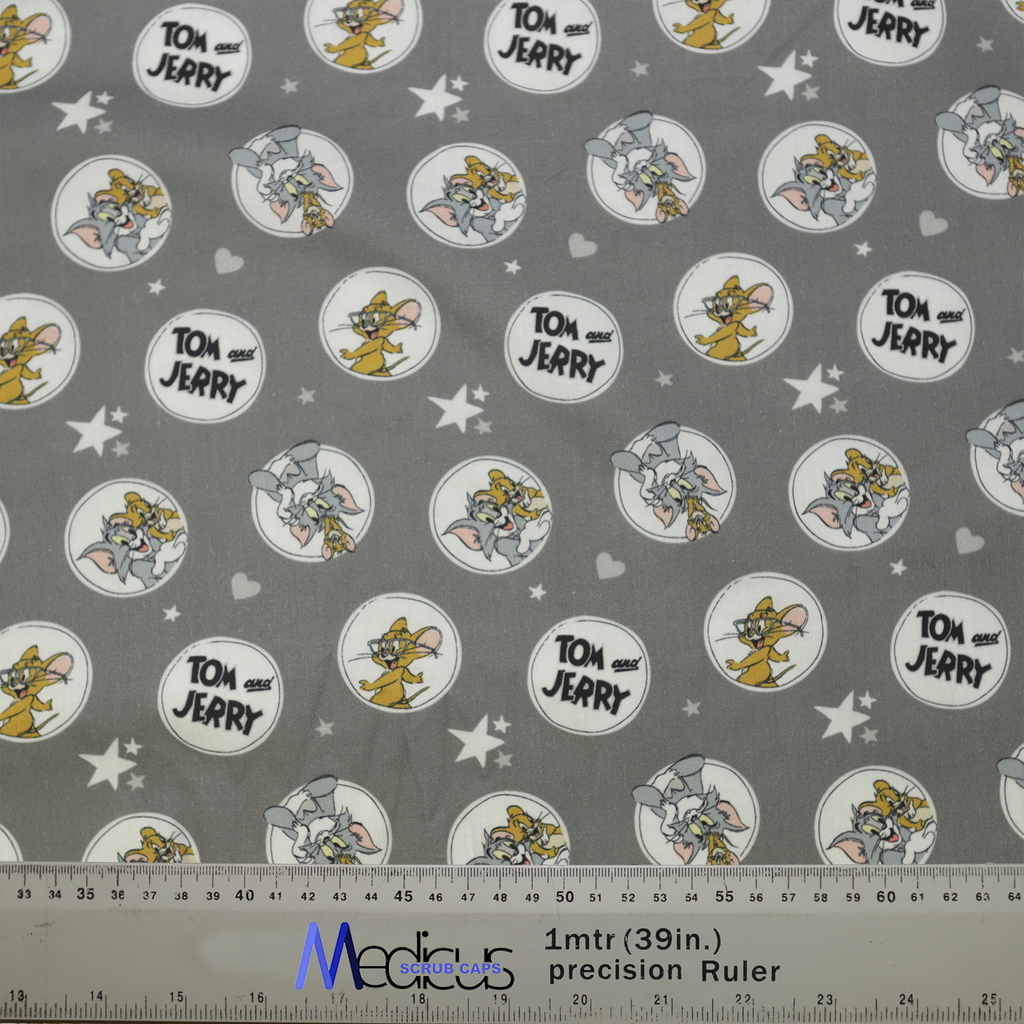 Tom And Jerry Circles Grey Scrub Cap from Medicus Scrub Caps, featuring a playful cartoon pattern on a grey background with stars and hearts.