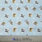 The Medicus Scrub Caps Tom And Jerry Circles On Blue Scrub Cap features light blue fabric with Tom and Jerry patterns, stars, and a ruler for scale.