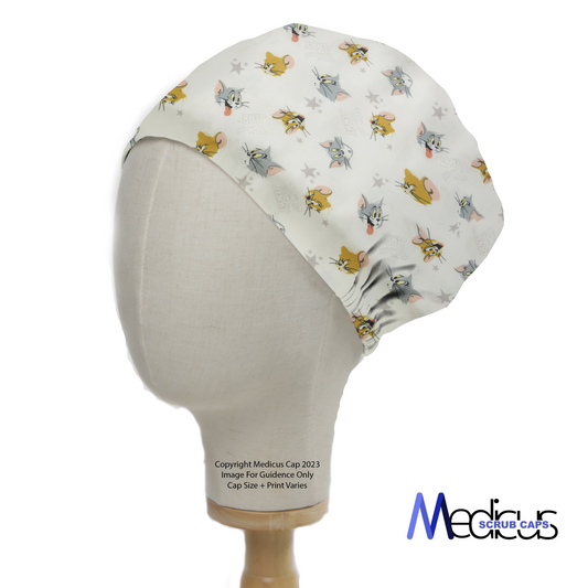 Tom And Jerry Heads Toss Scrub Cap from Medicus Scrub Caps, featuring a playful pattern of Tom and Jerry on a light background.