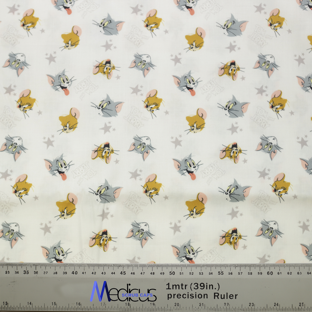 Tom And Jerry Heads Toss Scrub Cap from Medicus Scrub Caps, featuring a playful pattern of Tom and Jerry faces on a light background.