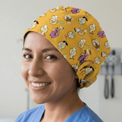 Orange Flintstones cartoon character pattern scrub cap worn by smiling healthcare worker