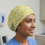 Yellow Tweety Bird cartoon pattern scrub cap with white background worn by healthcare worker