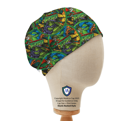 Mannequin head wearing Medicus Scrub Cap with Teenage Mutant Ninja Turtles print, on a wooden stand against a white backdrop.