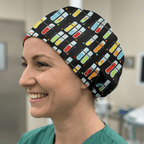 Colourful test tube pattern scrub cap with multi-coloured capsules on black background