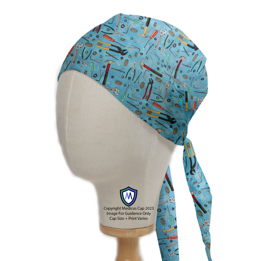 Tools Wrench Hammer On Lighter Blue Scrub Cap from Medicus Scrub Caps, featuring a pattern of various tools on a light blue background.