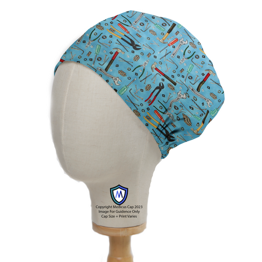 Tools Wrench Hammer On Lighter Blue Scrub Cap from Medicus Scrub Caps, featuring a pattern of various hand tools on a light blue background.