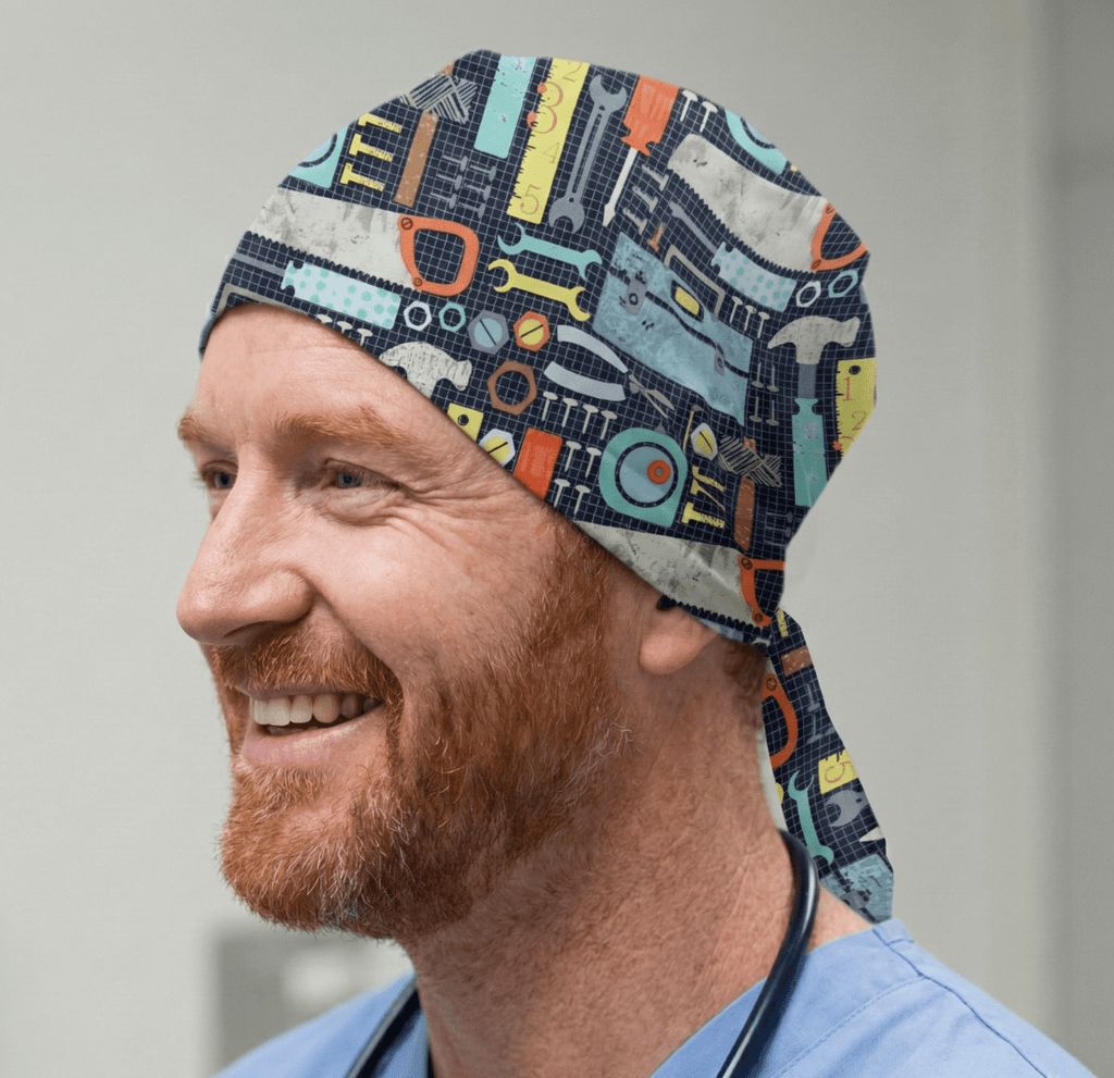 Construction tools pattern scrub cap with hammers saws in navy blue orange yellow