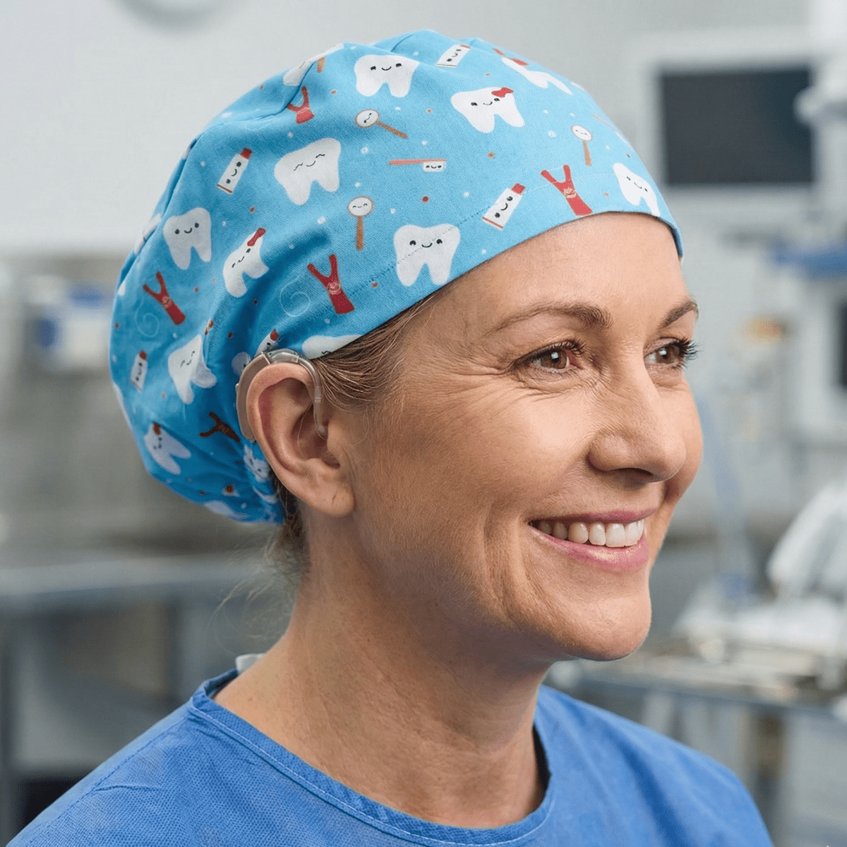 Turquoise blue scrub cap with cute cartoon tooth and toothbrush pattern for dental professionals