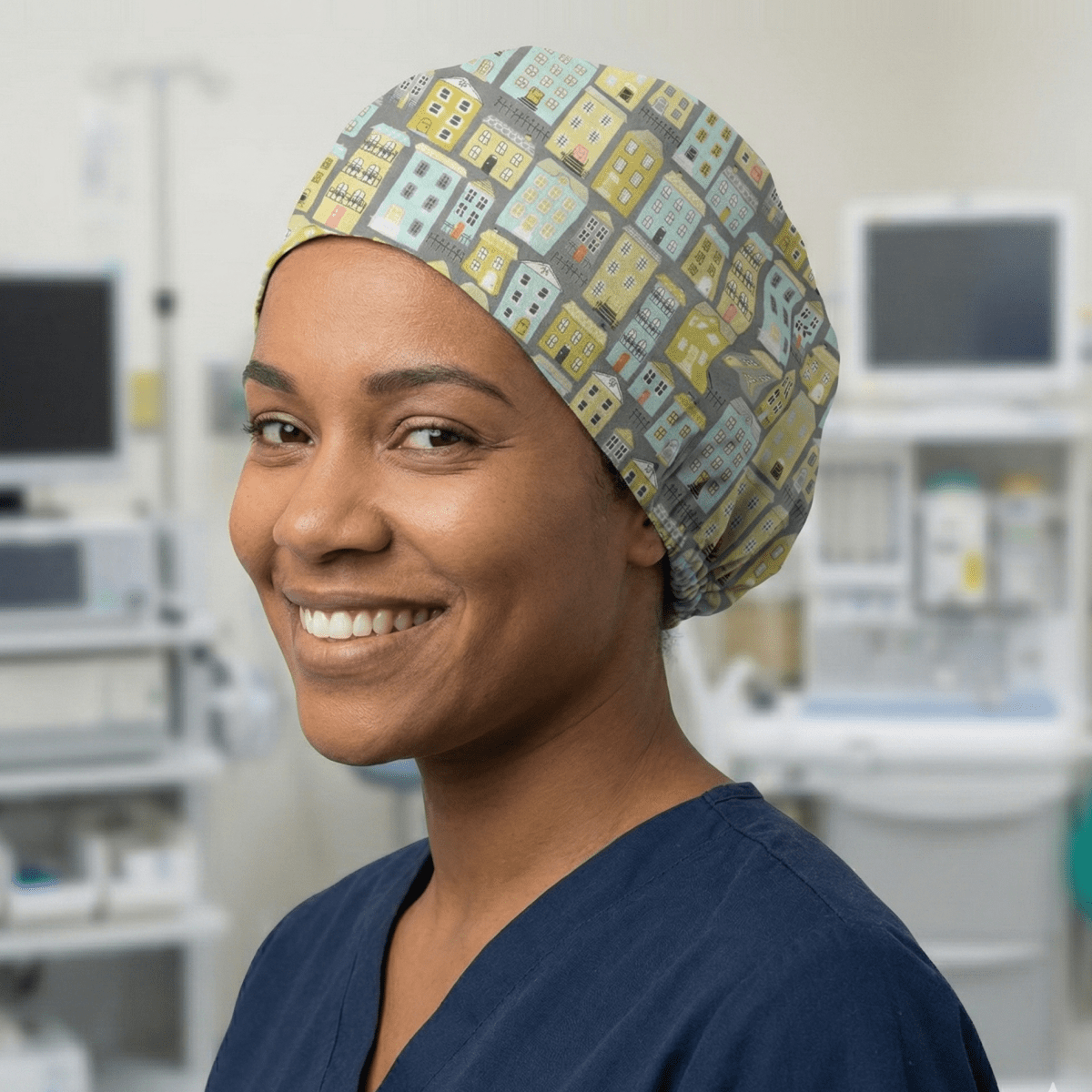 Townhouse scrub cap with colorful building pattern shown in side profile view on healthcare worker