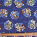 Disney Pixar Toy Story Buzz Woody Circles scrub cap fabric pattern close-up