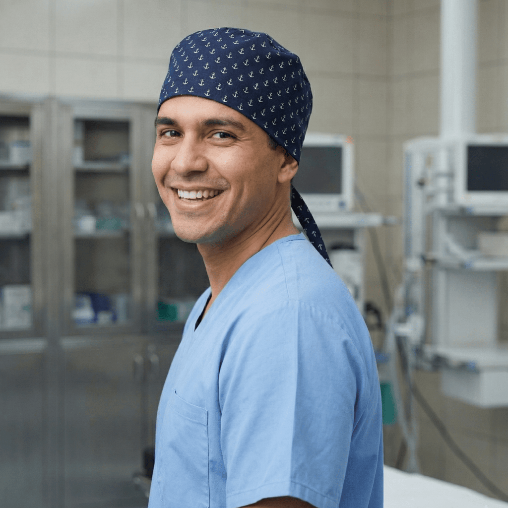 Healthcare professional wearing navy scrub cap with white star pattern, side profile view