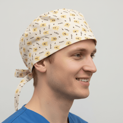Yellow Winnie the Pooh pattern scrub cap with tie-back closure on healthcare worker