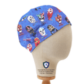 Blue elastic-backed scrub cap with colorful wrestling masks print on mannequin, side view.