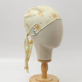 Side view of yellow custom scrub cap featuring animal print pattern, handmade by Medicus Caps