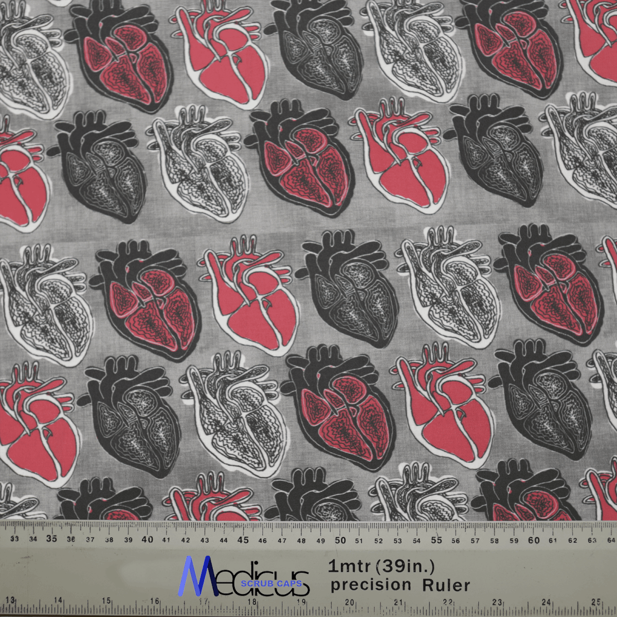 The Medicus Scrub Caps product features a hypoallergenic cotton fabric with anatomical hearts in black, white, and red on a gray background, ideal for an Abstract Heart Scrub Cap. A ruler at the bottom provides measurements in inches and centimeters.
