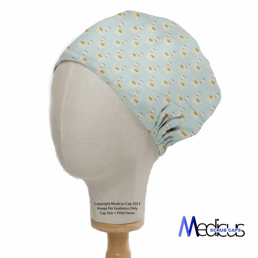 A side view of a mannequin head dons a Medicus Scrub Caps light blue scrub cap featuring an adorable alpaca/llama party pattern. Crafted from eco-friendly materials, this medical-style cap offers varied sizes and designs.