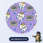 Another One Bites The Gauze scrub cap print: smiling teeth wearing gold crowns and biting gauze with music notes on lilac