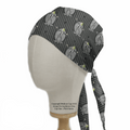 The Beetlejuice Scrub Cap by Medicus Scrub Caps showcases a whimsical penguin pattern with green accents. Reminiscent of Beetlejuices stripes, it features vertical lines and ties at the back for easy wear on a mannequin head.