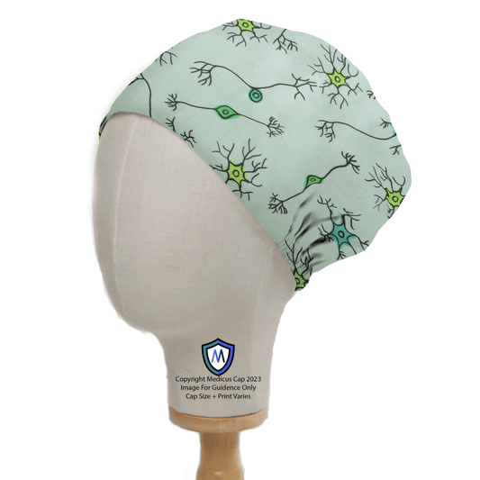 Displayed on a mannequin head is the Brain Neuron Network Scrub Cap from Medicus Scrub Caps, featuring a sustainable light green fabric with black neuron outlines and blue and green details, creating an intricate pattern that celebrates neuroscience.